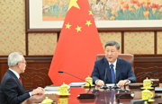 习近平听取岑浩辉述职报告